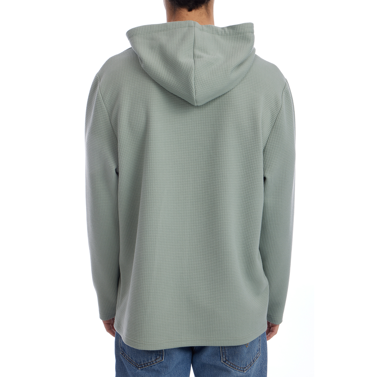 Person wearing a light green hooded sweatshirt on a white background