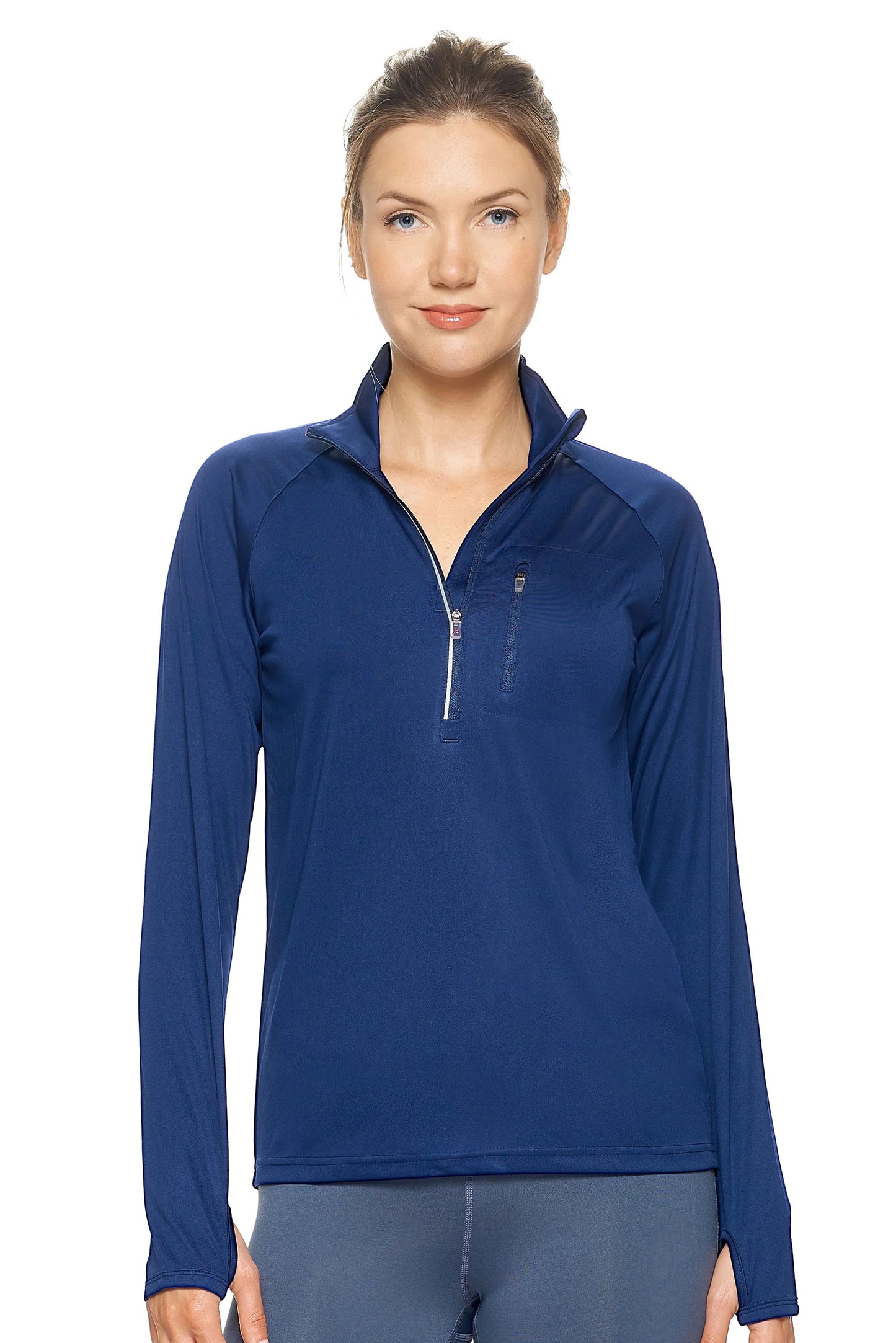Woman wearing a blue long-sleeve athletic top with a quarter zip on a white background