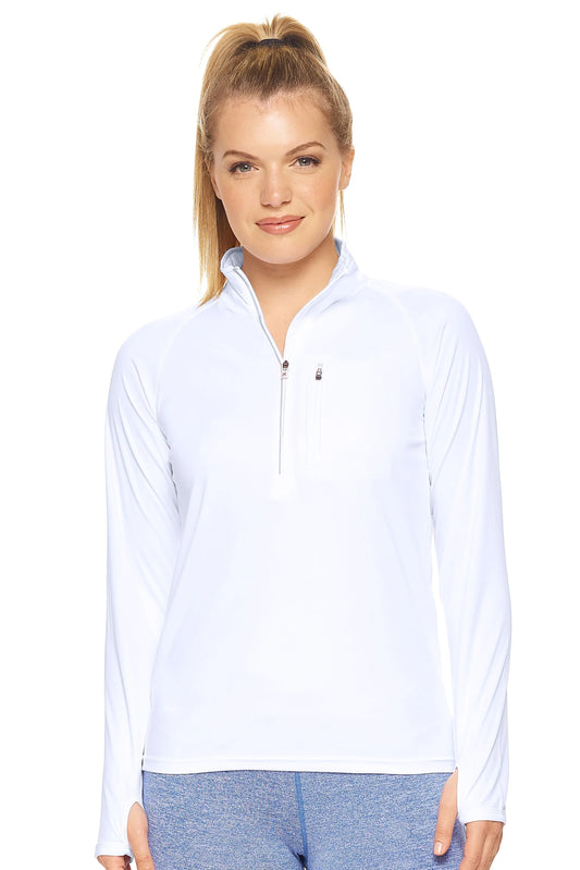 Woman wearing a light blue long-sleeve shirt with a quarter zip on a white background