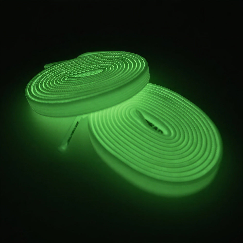 Glowing green shoelaces on a black background