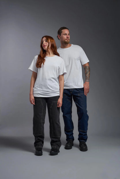 Two people wearing plain white t-shirts and dark pants against a gray background