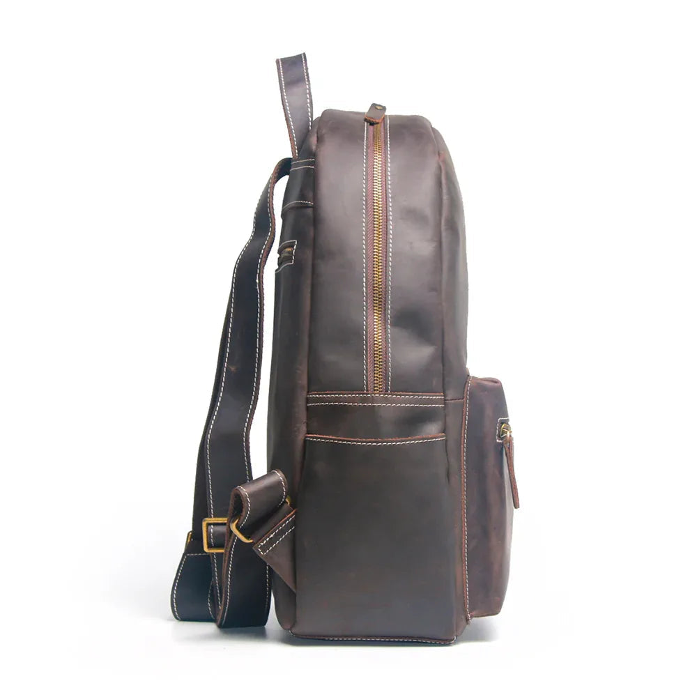 Brown leather backpack on a white background
