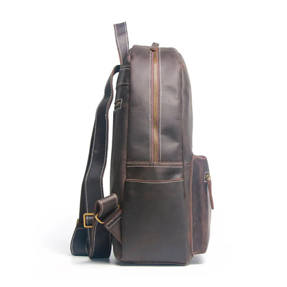Brown leather backpack on a white background