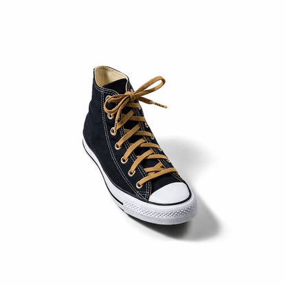 Black high-top sneaker with tan laces on a white background