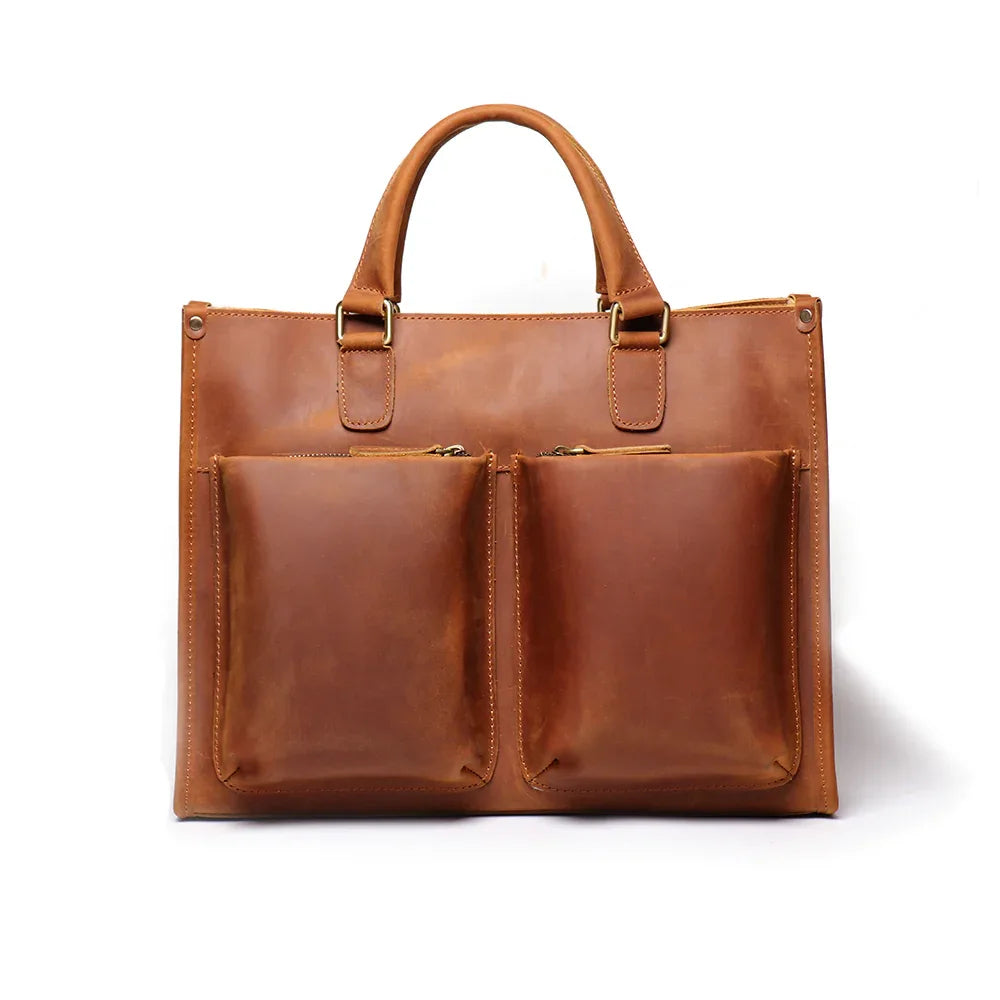 Brown leather messenger bag with two front pocket compartments and top handles
