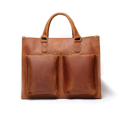Brown leather messenger bag with two front pocket compartments and top handles