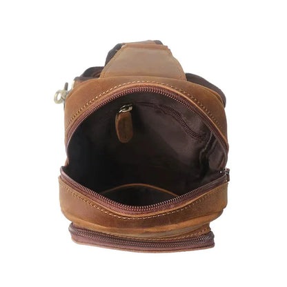 Brown leather crossbody pack front view, open mouth with inner zip pocket detail