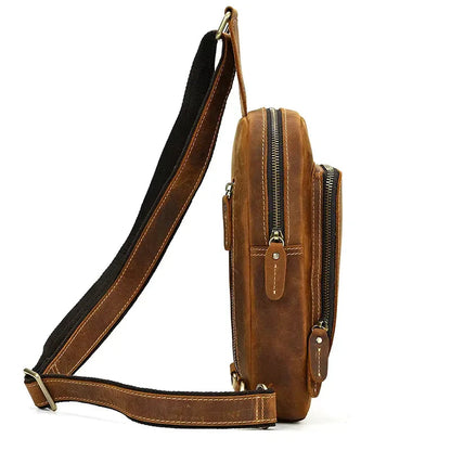 Brown leather crossbody sling bag with adjustable strap and two front zip compartments