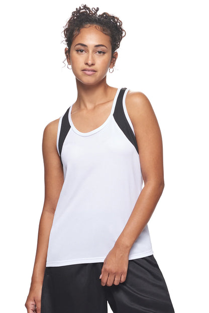 Woman wearing a white tank top with black accents on a white background