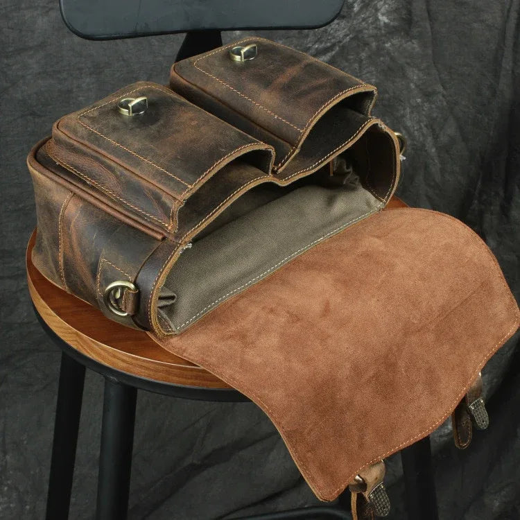 Brown camera messenger bag with suede-look flap, two compartments, and front buckle closures