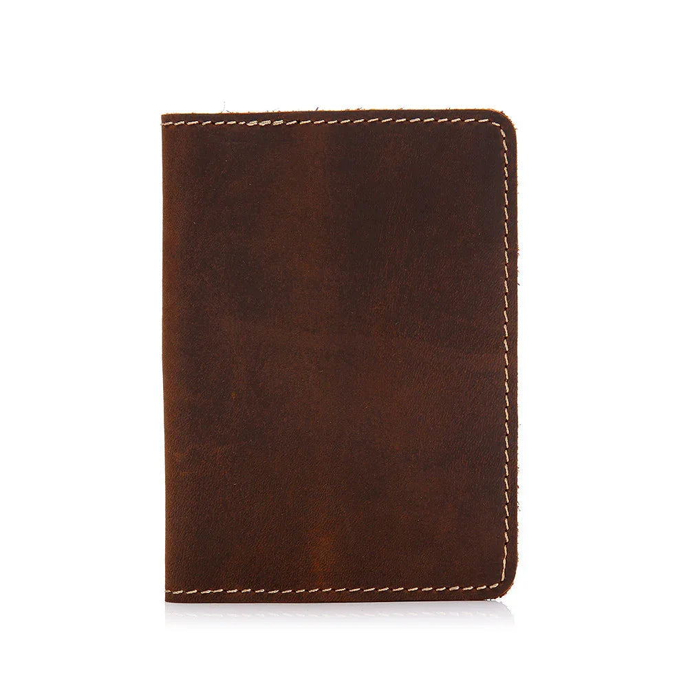 Brown leather passport cover with contrast topstitching, front view.