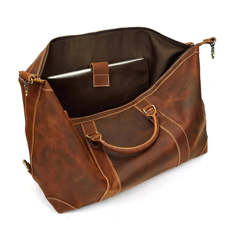 Brown leather duffle bag open top with interior pocket and zipper closure