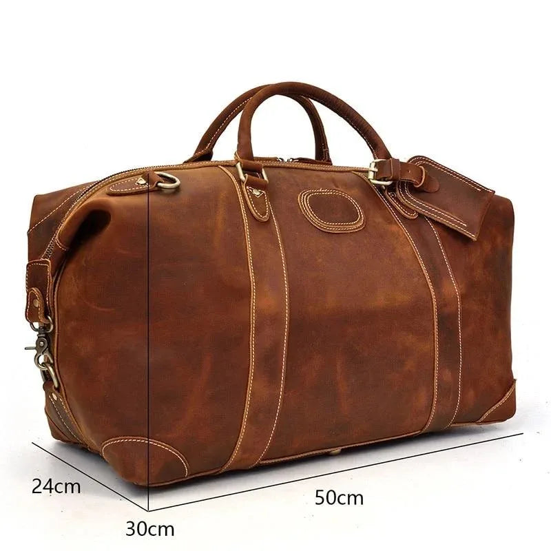 Vintage leather duffle bag with strap and visible dimensions: 50cm x 30cm x 24cm.