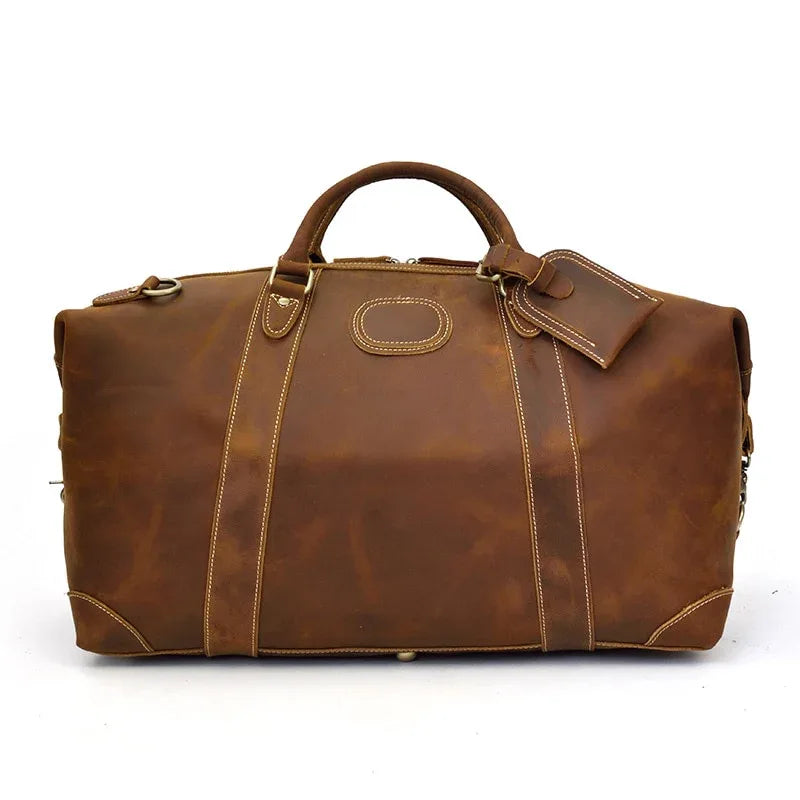 Vintage leather duffle bag in brown with top handles and central front patch pocket.