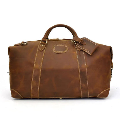 Vintage leather duffle bag in brown with top handles and central front patch pocket.