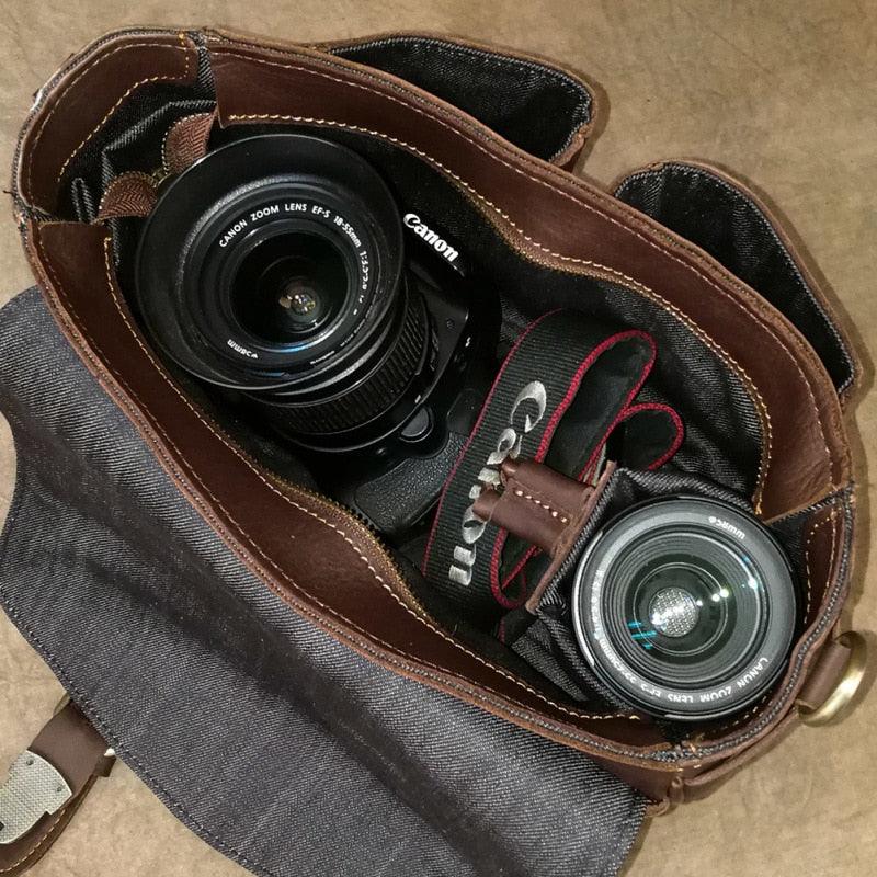 Brown leather camera bag interior with lens pockets and camera accessories