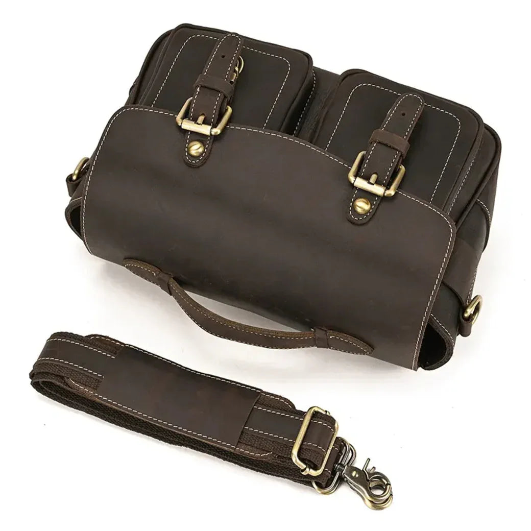 Brown vintage crossbody camera bag with flap, buckles, and detachable shoulder strap