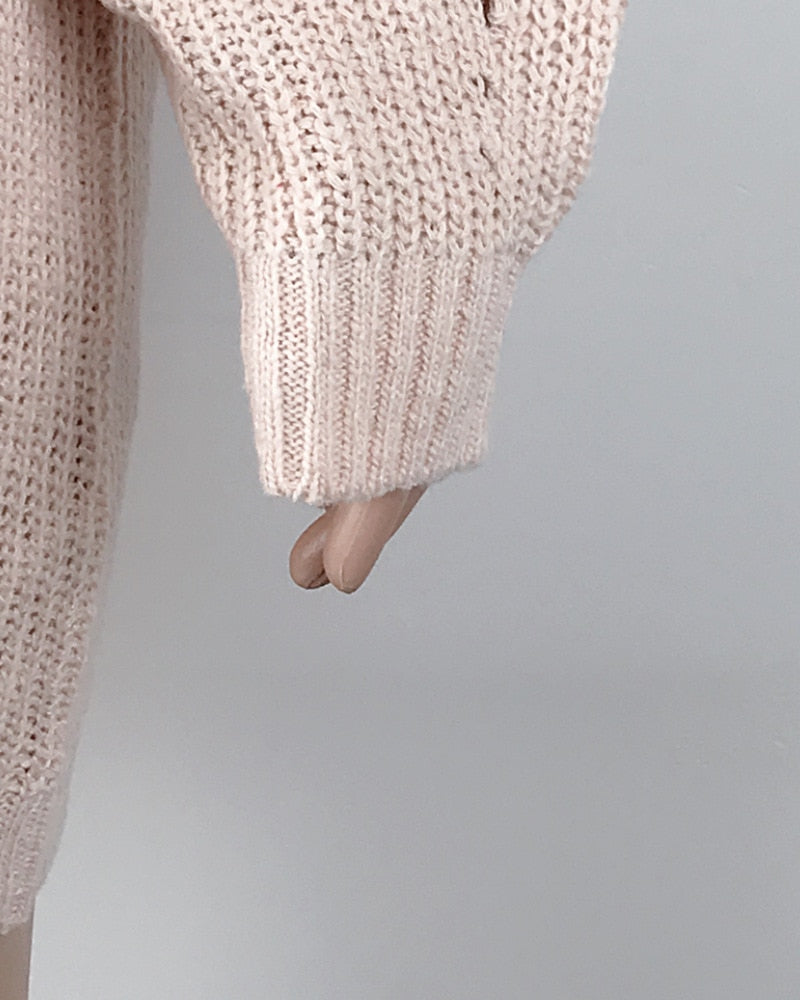 Women's Oversized Turtleneck Sweater pink arm close up of knitting