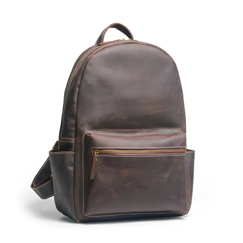 Brown leather backpack on a white background