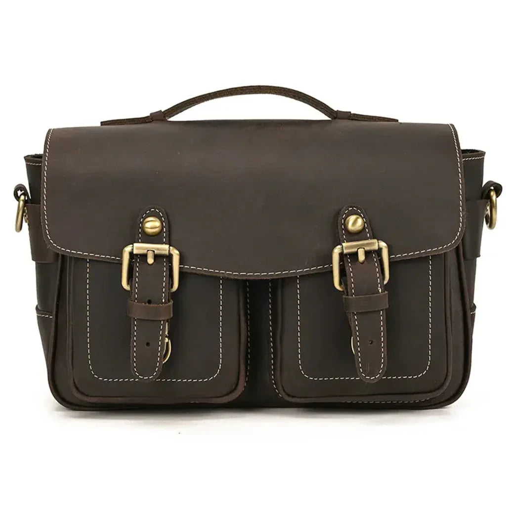 Brown messenger camera bag with front flap, two buckle straps, and stitched pockets