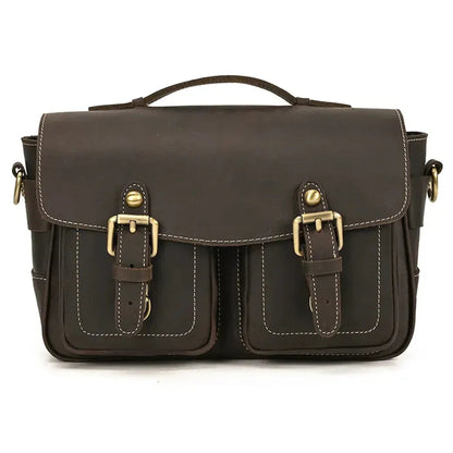 Brown messenger camera bag with front flap, two buckle straps, and stitched pockets