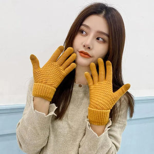 Heated Thermal Gloves in orange, model holding the gloves up
