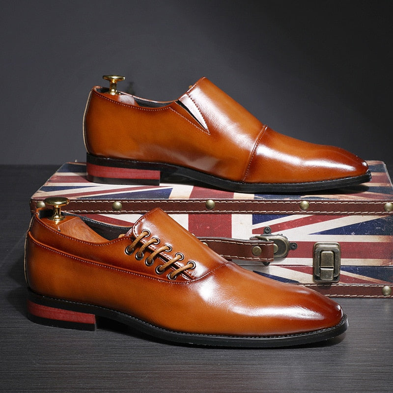 Men's Classic Leather Professional Slip-On brown one shoe propped up on a box with the flag of England