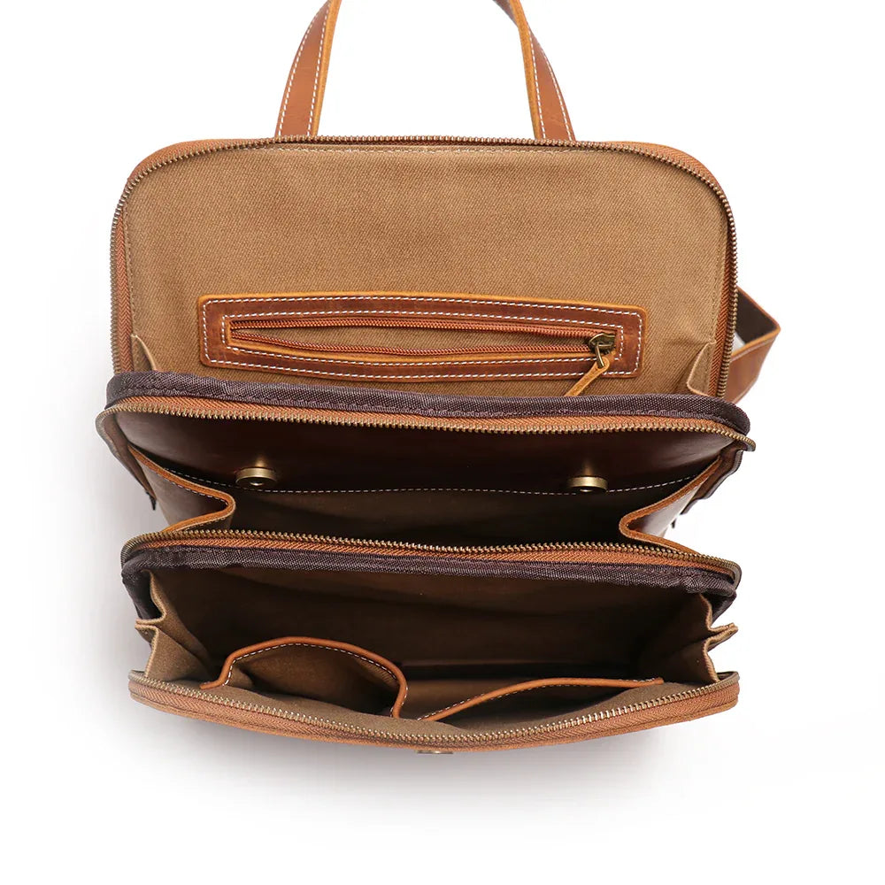 Small leather backpack open interior with top zip and gusseted compartments