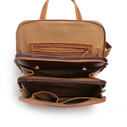 Small leather backpack open interior with top zip and gusseted compartments