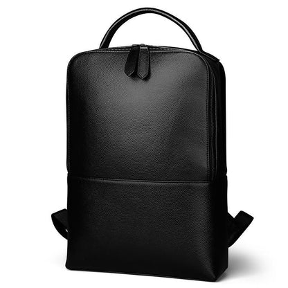 Black leather backpack with textured finish, top handle, and front zip closure
