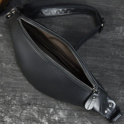 Black leather fanny pack interior view with double zipper track and lining