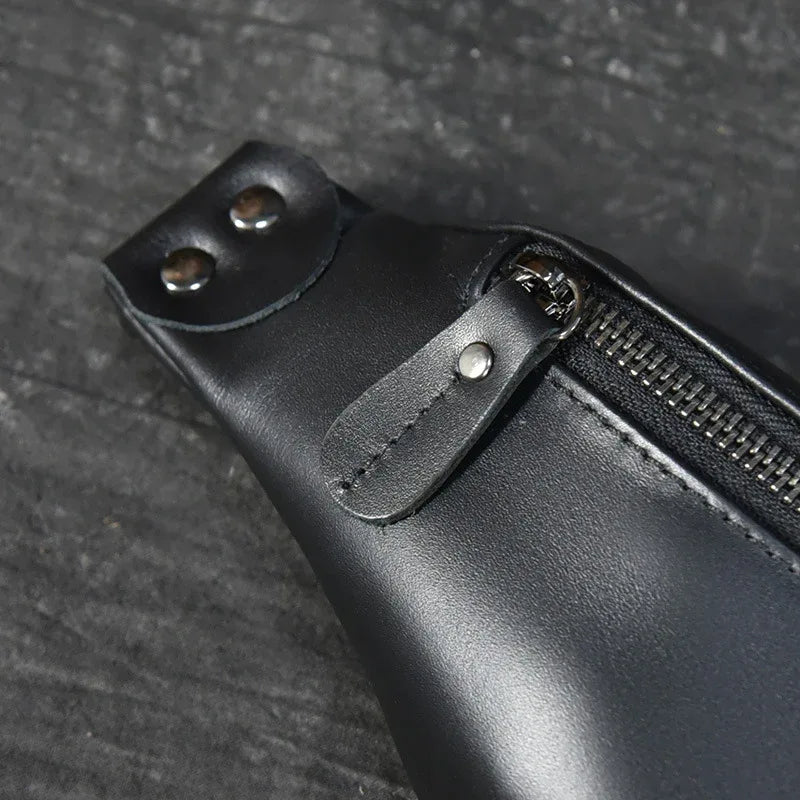 Black leather fanny pack corner with rivets and zipper pocket edge