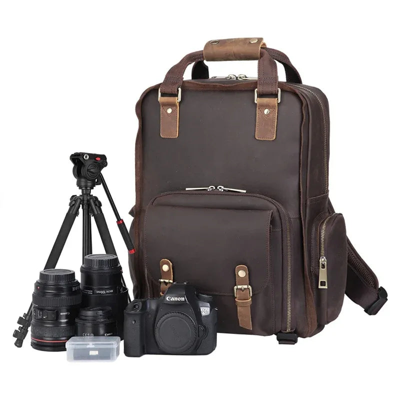 Dark brown leather camera backpack with top handle and front tripod holder
