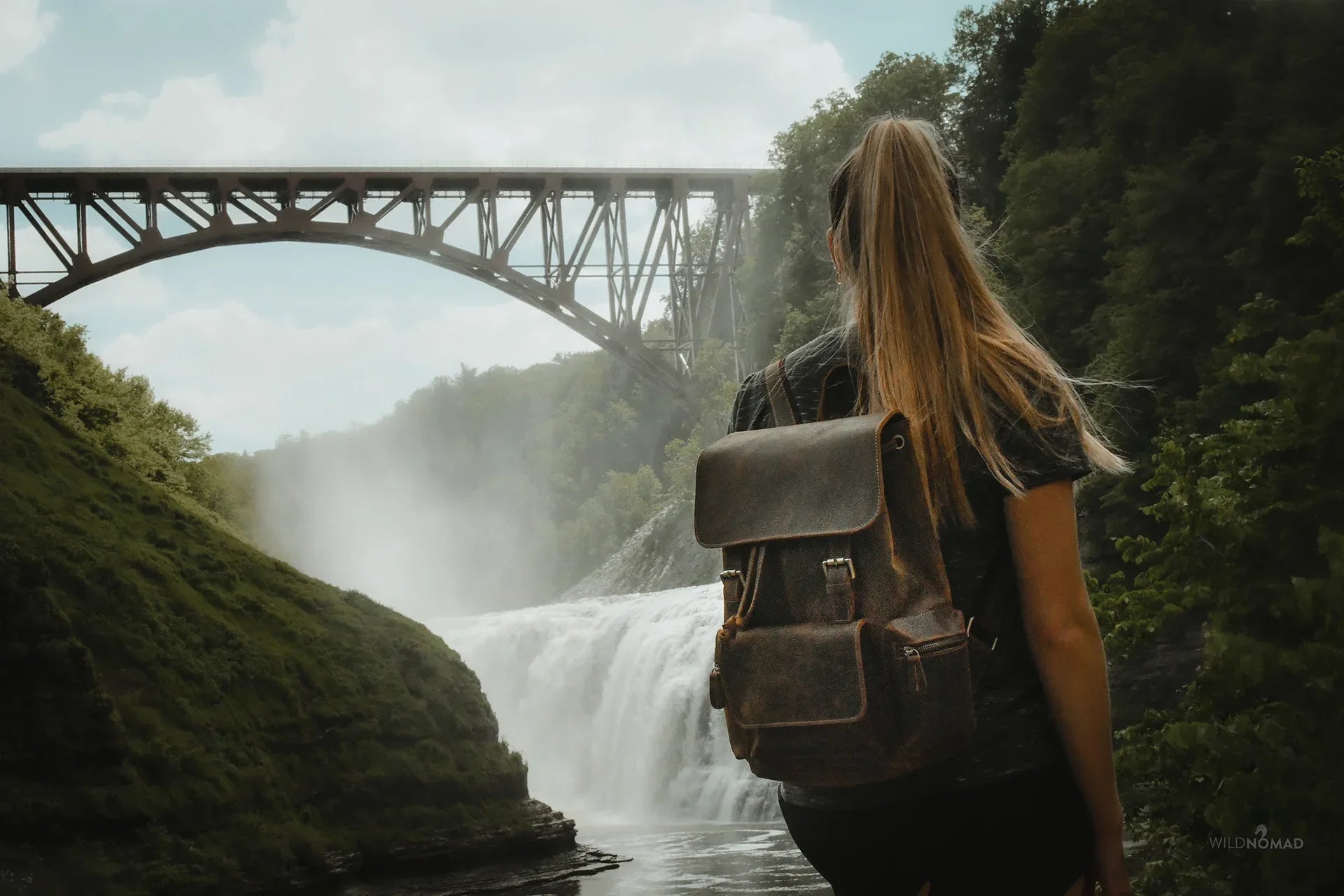 Brown vintage leather backpack on back with top flap and front compartments.