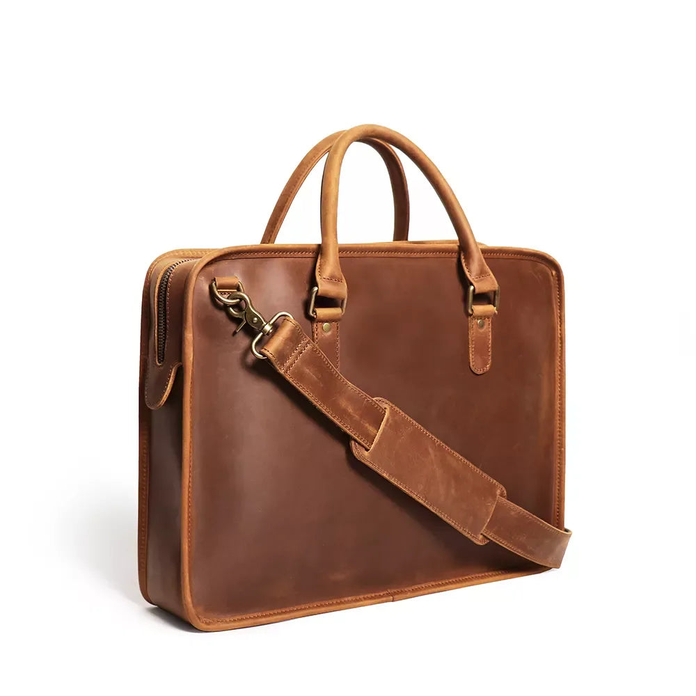 Vintage leather briefcase in brown with top handles and front strap detail