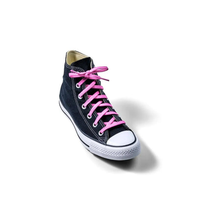 Black high-top sneaker with pink laces on a white background