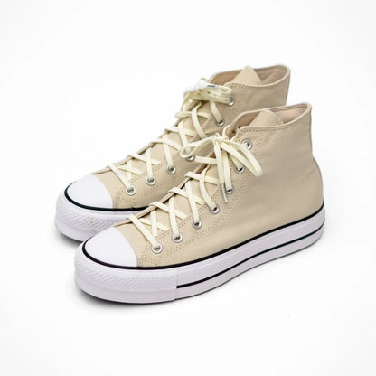 Pair of beige high-top sneakers with white laces on a white background