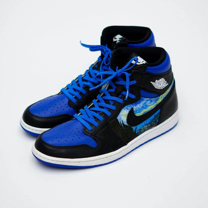 Black and blue high-top sneakers with a white background
