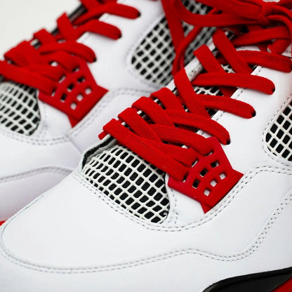 White sneakers with red laces and text on a white background