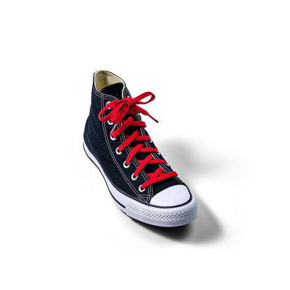 Black high-top sneaker with red laces on a white background