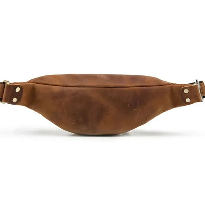 Brown leather fanny pack with wide adjustable belt strap and top zipper