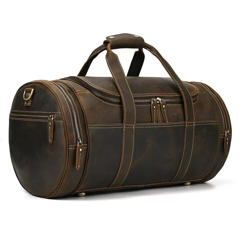 Round leather duffle bag with wide handles and multiple front zip pockets