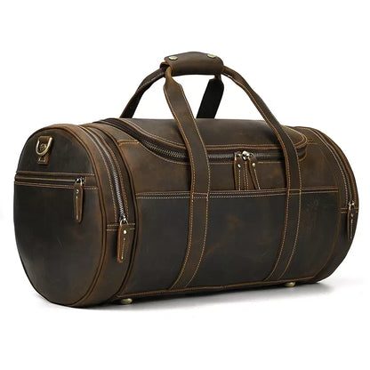 Round leather duffle bag with wide handles and multiple front zip pockets