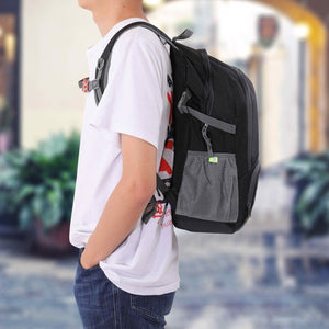 Light Weight Flexible Black Backpack with Storage Pack on a model in a school setting outdoors