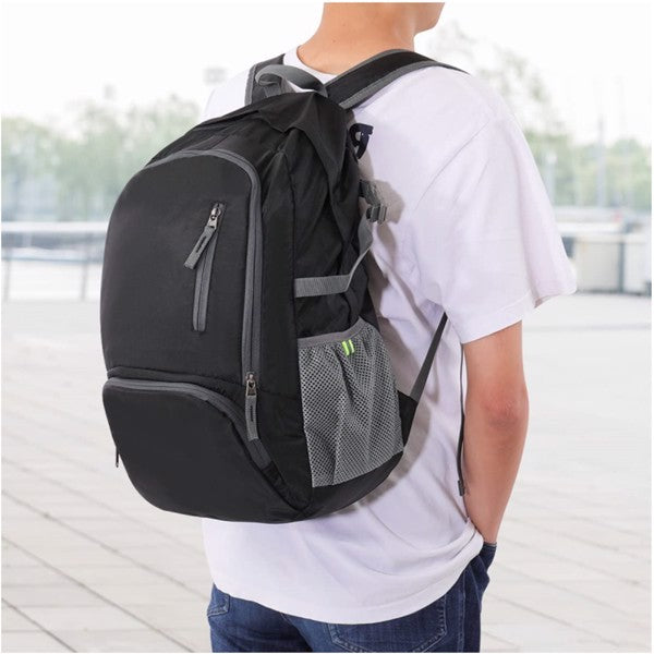 Light Weight Flexible Black Backpack with Storage Pack on a model in a school setting