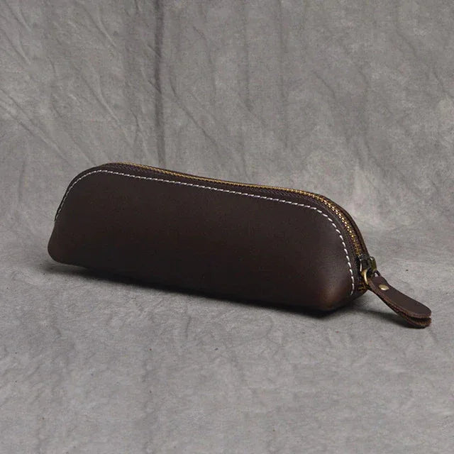 Dark brown leather makeup pouch with zipper and leather wrist strap
