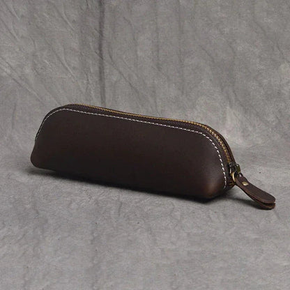 Dark brown leather makeup pouch with zipper and leather wrist strap