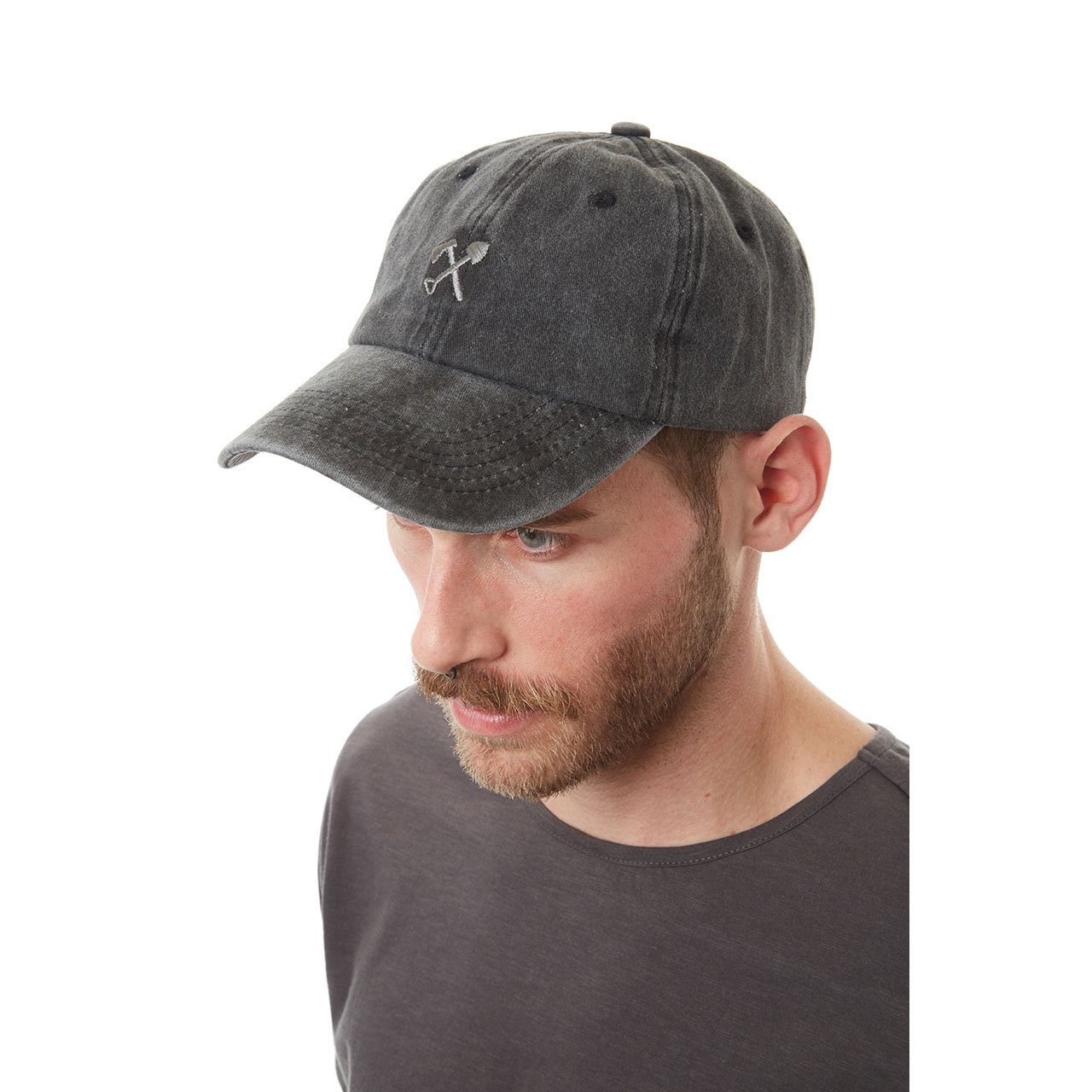 Man wearing a gray baseball cap on a white background