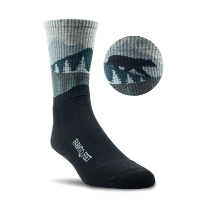 Black and gray sock with mountain design, featuring a close-up inset on a white background.