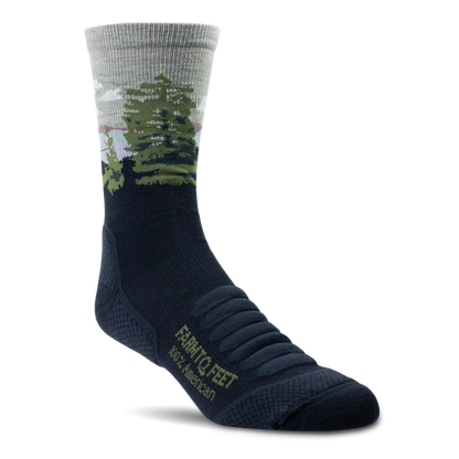Black and gray sock with a forest design on a white background
